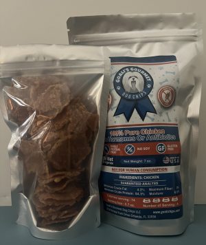 Goali's Gourmet chicken breast dog chips in an open clear bag beside the labelled 7 oz bag
